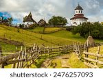 Europe, Romania, Transylvania, Carpathian Mountains. Hill sides, hiking trails, fields. Village church.