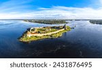 Europe. Russia, Leningrad region, St. Petersburg, Aerial panoramic view on fortress Oreshek near Schlesselburg town. Ancient Russian fort on island in Ladoga lake in sunny summery day.