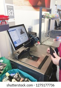 Europe UK East Lincolnshire December 2018. Inside Major Supermarket. Customer Self Service Till. Scanning Food Items In Bagging Area.