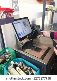 Europe UK East Lincolnshire December 2018. Inside Major Supermarket. Customer Self Service Till. Scanning Food Items In Bagging Area.