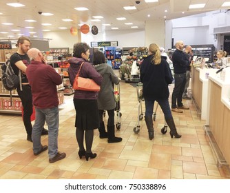 Europe UK Northamptonshire Rushden October 2017. Inside Major Uk Supermarket At Customer Service Desk. Queue Of Customers Waiting To Be Served.