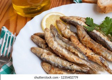 European Anchovy Fried With Lemon And Parsley Garnish