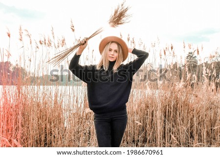 Similar – Image, Stock Photo Blonde woman portrait with the hands in her hat, discovering the forest.