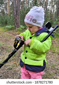 European Child Learns How To Work An Old Metal Detector In The Field In The Forest August 11 2019