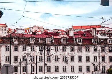 European cityscape showcasing historic buildings with red tiled roofs and old lamp posts. Highlighting architectural beauty and the vibrant urban atmosphere of the neighborhood - Powered by Shutterstock