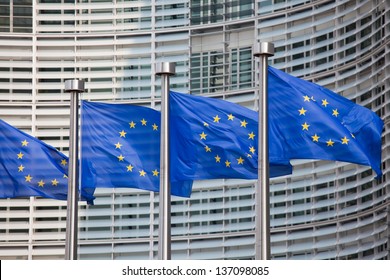 European flags in front of the Berlaymont building, headquarters of the European commission in Brussels. - Shutterstock ID 137098085