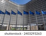 European flags in front of headquarters of European commission in Brussels in summer day