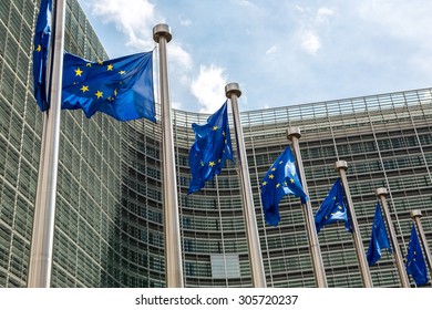 European flags in front of  headquarters of European commission in Brussels in summer day - Shutterstock ID 305720237