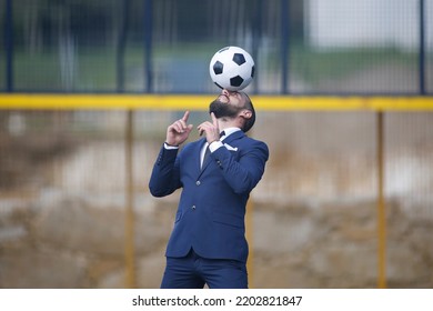 European Football Championship Concept. Businessman Playing Soccer Ball.