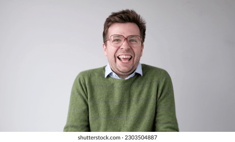 European funny young man is laughing loudly. Positive emotion - Shutterstock ID 2303504887