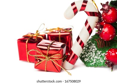 european holly with candy cane and gift box  - Powered by Shutterstock