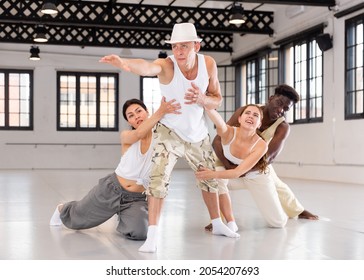 European Male Dancer Enjoying Dancing Break Dance With His Team At Rehearsal Studio Room