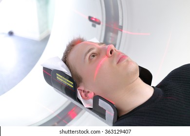 European Man Are Entering Brain With CT Scan In Hospital Room