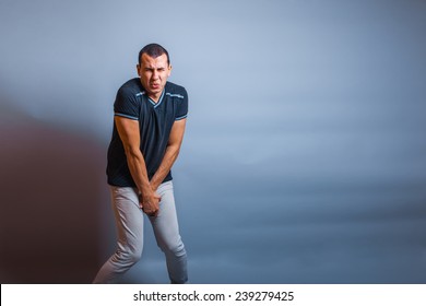 European The Man Holding His Hands Over Groin In Pain On A Gray Background