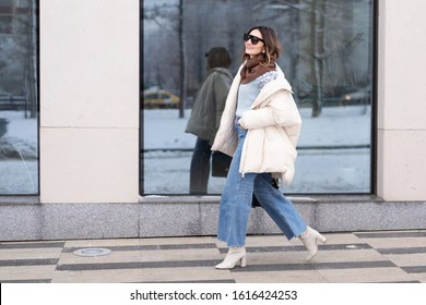 Candid street, skinny pants and shiny down jacket