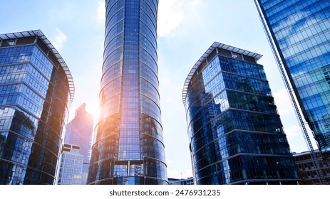 European modern office architecture. View of modern skyscrapers in business district against blue sky. Looking up at business buildings in downtown. - Powered by Shutterstock