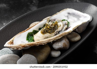 European Oyster With Black Caviar And Gold Leaf. 