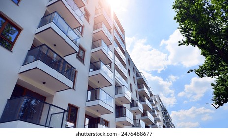 European residential architecture harmonizing with nature. Eco-friendly living in city with greens. Eco apartment building saving energy and fresh air concept.  - Powered by Shutterstock