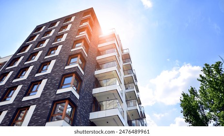 European residential architecture harmonizing with nature. Eco-friendly living in city with greens. Eco apartment building saving energy and fresh air concept.  - Powered by Shutterstock