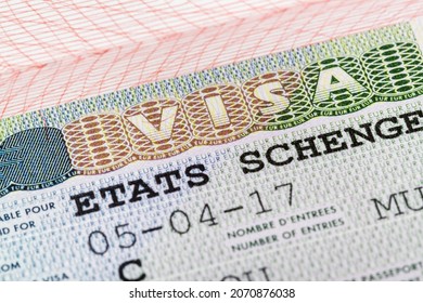 European schengen visa in passport - travel background - Shutterstock ID 2070876038