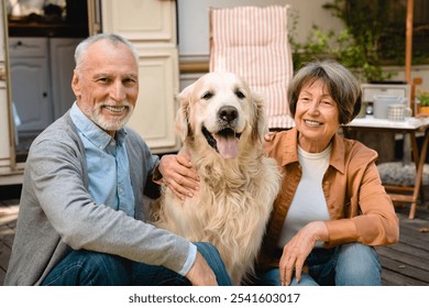 European senior happy couple spouses husband and wife grandparents traveling with dog golden retriever labrador in trailer minivan camper wheel motor home - Powered by Shutterstock