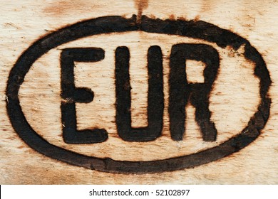 European Sign Engraved With Burn Marks On A Piece Of Wood