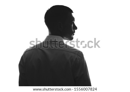 European silhouette of man in profile from behind in business shirt looking to side isolate on white
