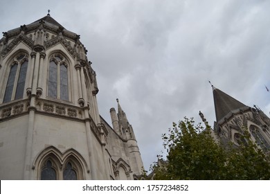 European stone gothic church spire with stormy sky backdrop. 