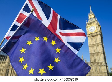 European Union And British Union Jack Flag Flying In Front Of Big Ben And The Houses Of Parliament At Westminster Palace, London, In Preparation For The Brexit EU Referendum