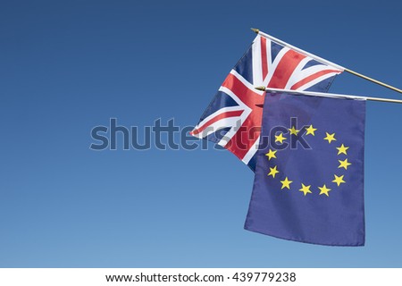 European Union and British Union Jack flag flying in front of bright blue sky in preparation for the Brexit EU referendum