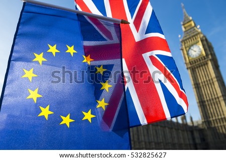 European Union and British Union Jack flag flying in front of Big Ben and the Houses of Parliament at Westminster Palace, London, in symbol of the Brexit EU referendum