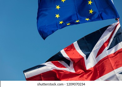 European union and British Union jack flags flying together. Brexit concept - Shutterstock ID 1209070234