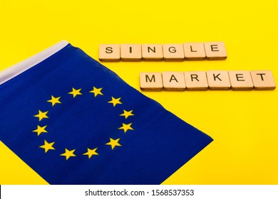 European Union Concept Showing The Flag Of The EU On A Yellow Background With A Sign Reading Single Market