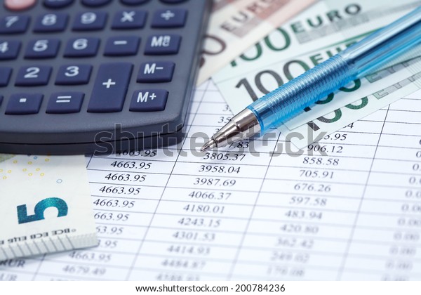 European Union Currency near calculator and\
pen on paper background with digits\
table