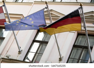 European Union flag as background.