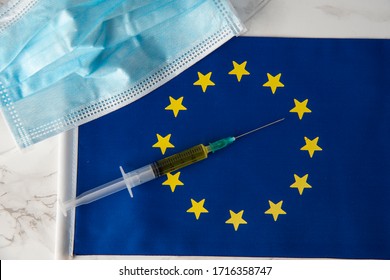 european union flag with covid19 vaccine and medical mask
