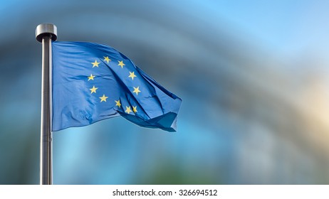 European Union flag in front of the Berlaymont building (European commission) in Brussels, Belgium. - Shutterstock ID 326694512