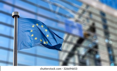 European Union flag in front of the Berlaymont building (European commission) in Brussels, Belgium. - Shutterstock ID 326694653