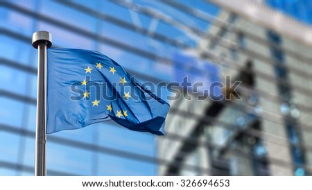 European Union flag in front of the Berlaymont building (European commission) in Brussels, Belgium.