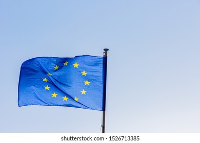 european union flag on blue sky background
