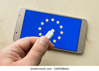 European Union Flag And USB C Charger The Only USB C Charger Approved In The Plenary Session Of The European Parliament. USB Type C Only Option In 2022. USB-C Concept On The Flag Of EU On A Mobile