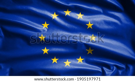 European Union flag waving in the wind. Close up of Europe banner blowing, soft and smooth silk. Cloth fabric texture ensign background. Use it for national day and country occasions concept.