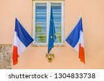 European Union and French flag on classical building wall
