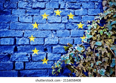 European Union Grunge Flag On Brick Wall With Ivy Plant, Country Symbol Concept Of EU

