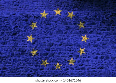European Union national flag painted on a rough stone wall