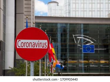 European Union Parlament With Flagpoles And Covid Sign, Coronavirus Lockdown Concept