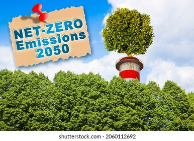 European Union sets new climate law: net-zero emissions are now a target for 2050 - Carbon Neutrality concept against a woodland background and tree on top of a chimney - Shutterstock ID 2060112692