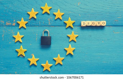 European Union sign with a padlock on a blue rustic wooden background, DSGVO concept image