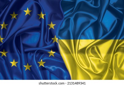 European union and Ukraine two folded silk flags together - Powered by Shutterstock