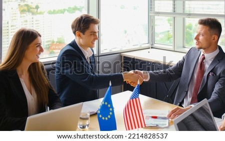 European Union and The United States leaders shaking hands on a deal agreement